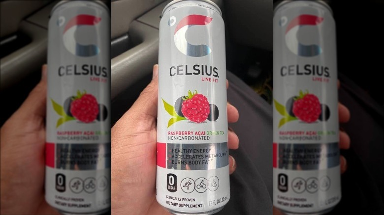 Person holding can of Celsius energy drink