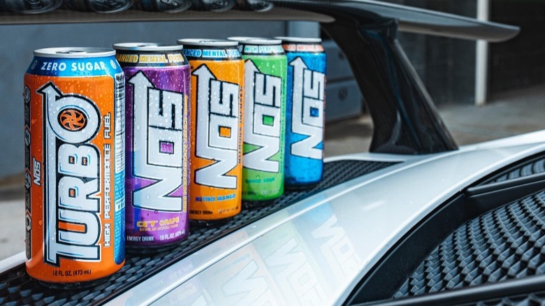 Cans of NOS energy drinks on race track