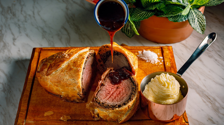 Beef Wellington With Potatoes and Sauce 