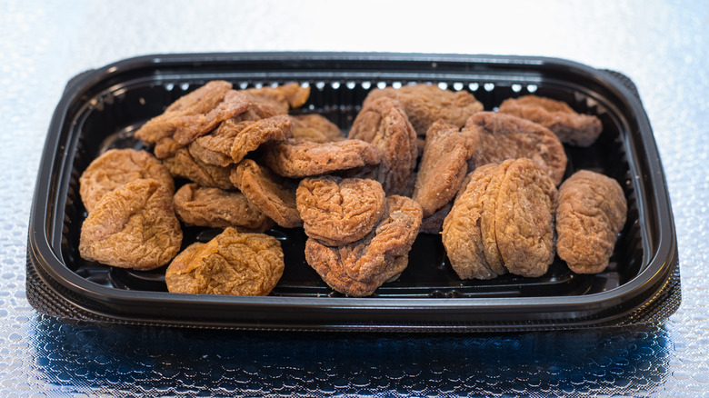 container of dried salted plums