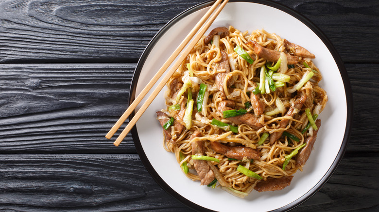 Pork chow mein with chopsticks