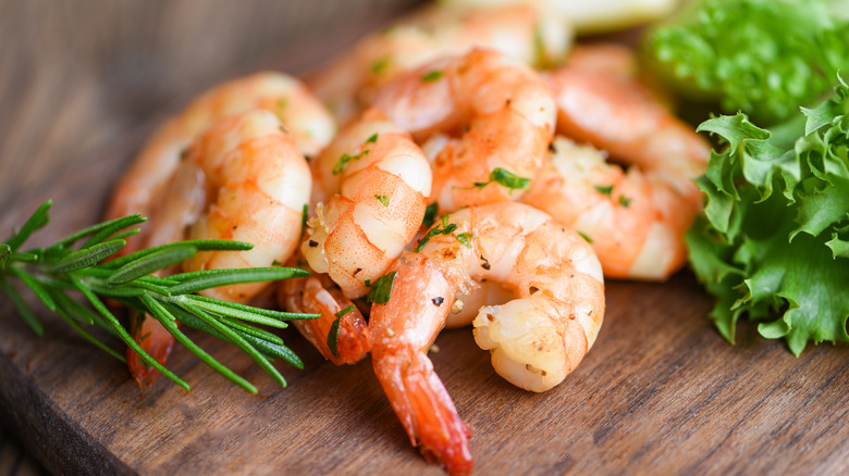 Cooked shrimp on cutting board