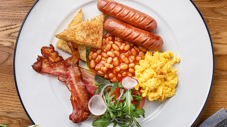 Stylized full English breakfast with scrambled eggs 