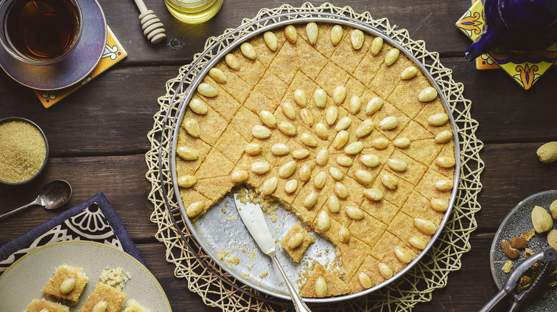 Round basbousa with almond decoration