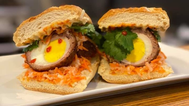 scotch egg banh mi cut in half