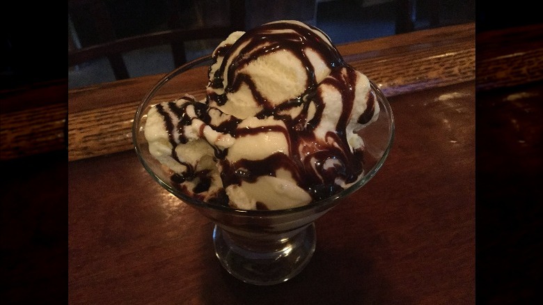 glass bowl of garlic ice cream and chocolate drizzle