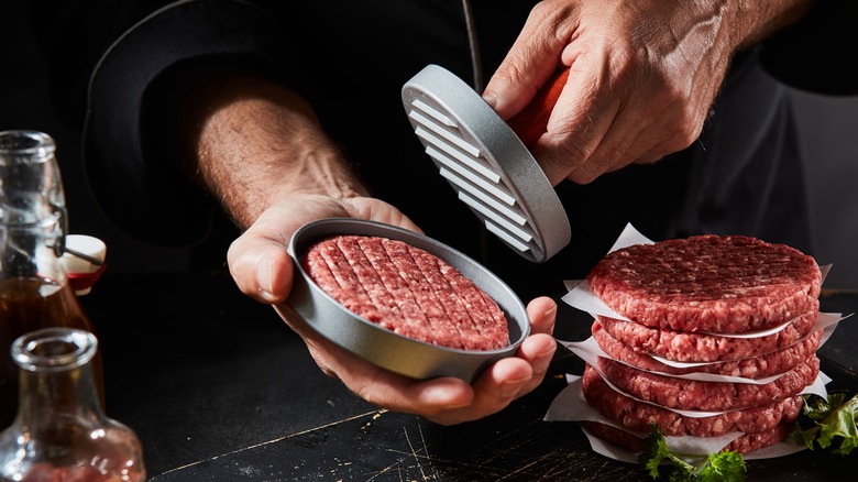 chef shaping burger patties 