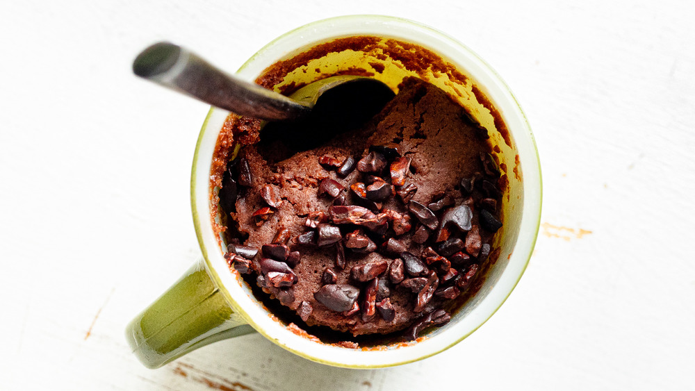 mug cake with toppings and spoon