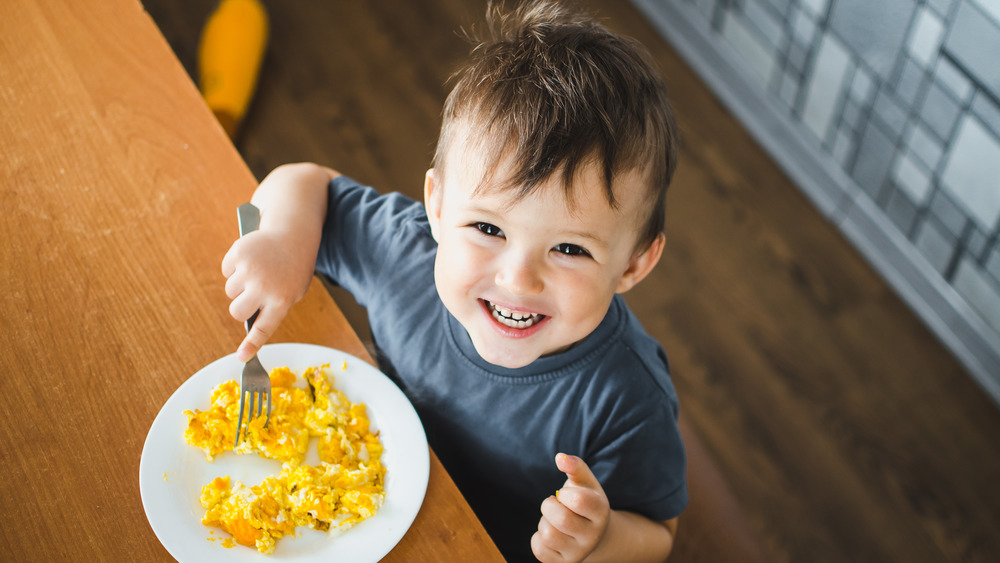 Child eating omelette 