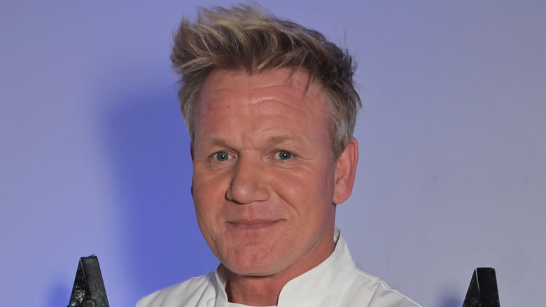 Gordon Ramsay smiles in chef uniform