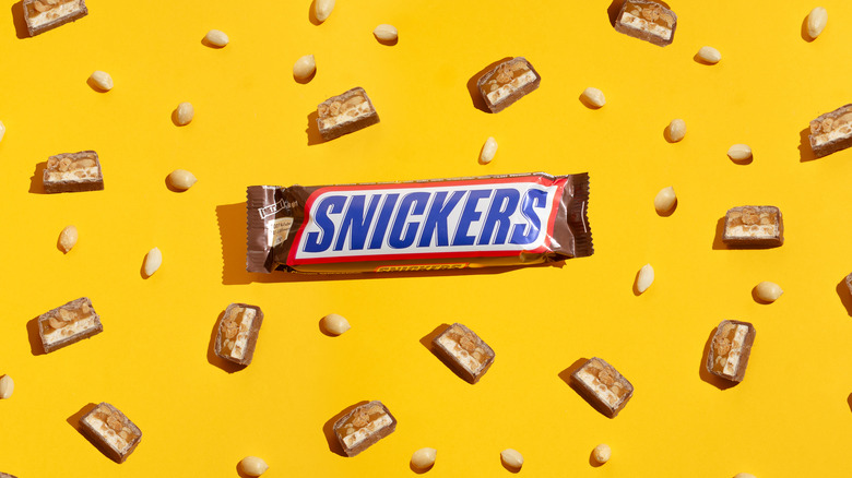 snickers bar on yellow background