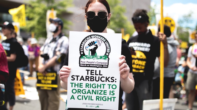 Protester holding Starbucks Workers United sign