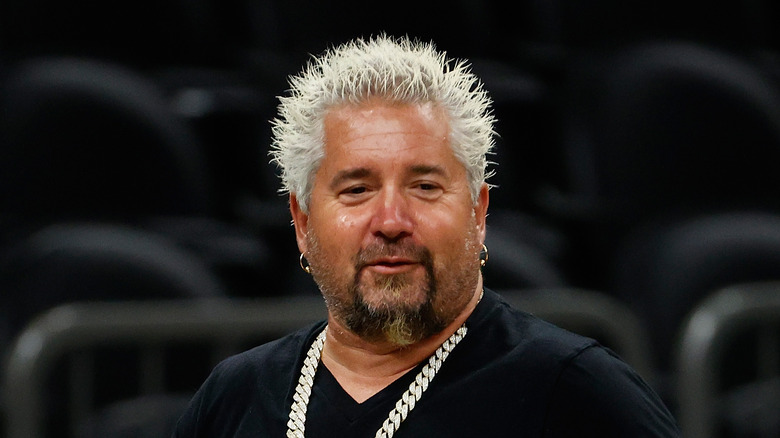 Guy Fieri with chain necklace and earrings