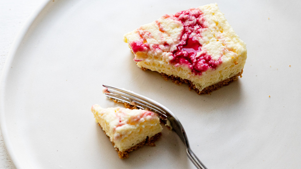 no-bake jello cheesecake with berry swirl on a plate