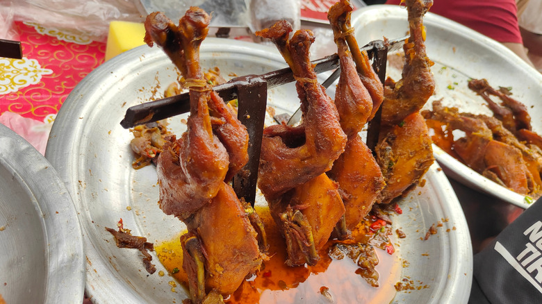 whole chickens over large dish