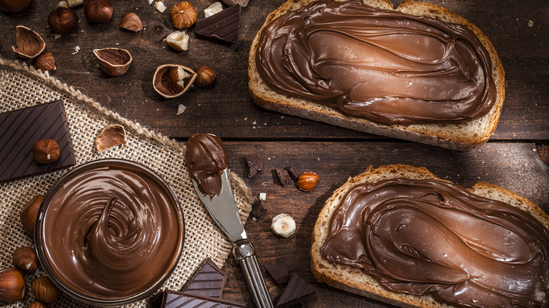 Nutella in bowl, on knife, and on bread