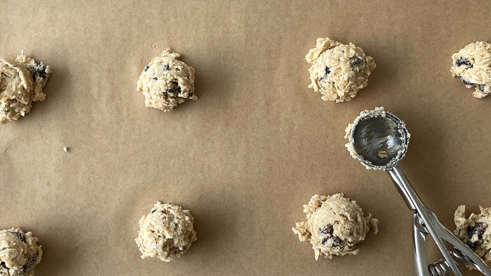 tool scooping oatmeal raisin cookies