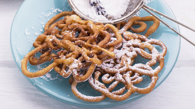 powdered sugar on funnel cake