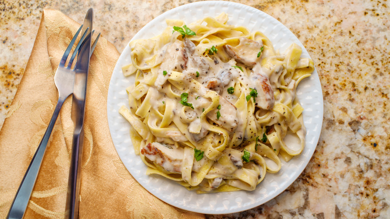 Chicken Alfredo on white plate