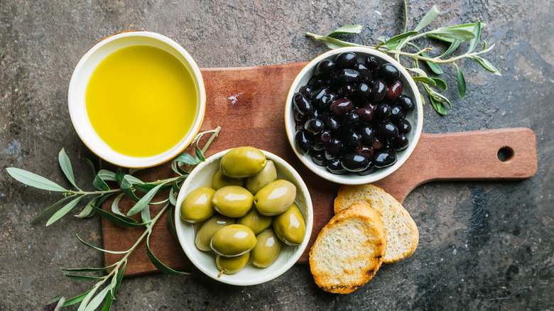 Two kinds of olives and olive oil