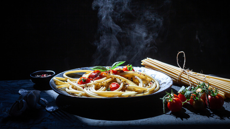 fresh pasta on plate with tomatoes