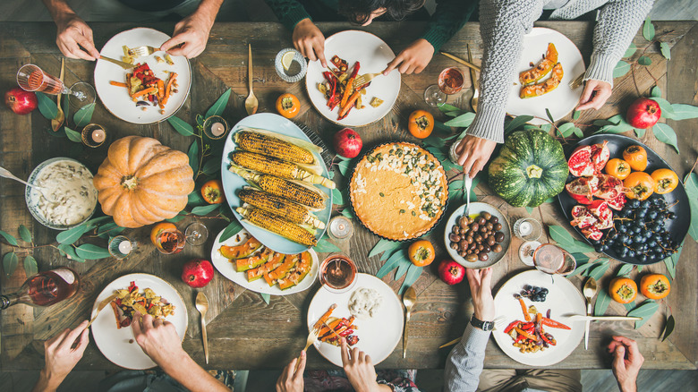 vegan friendsgiving feast on a wooden table