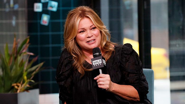 Close-up of Valerie Bertinelli with a microphone