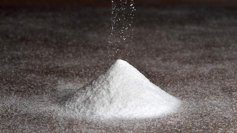 Salt sprinkled into pile