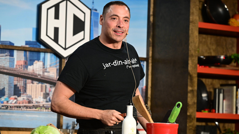 Jeff Mauro cooking on stage