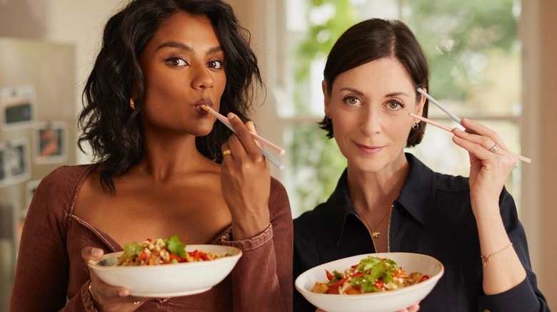 Simone Ashley and Mary McCartney eat noodles