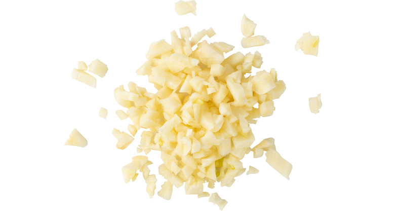 Minced garlic on white background