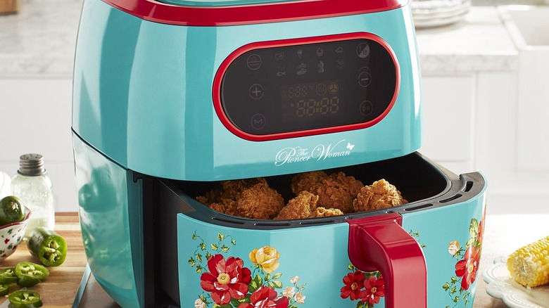 An air fryer containing chicken