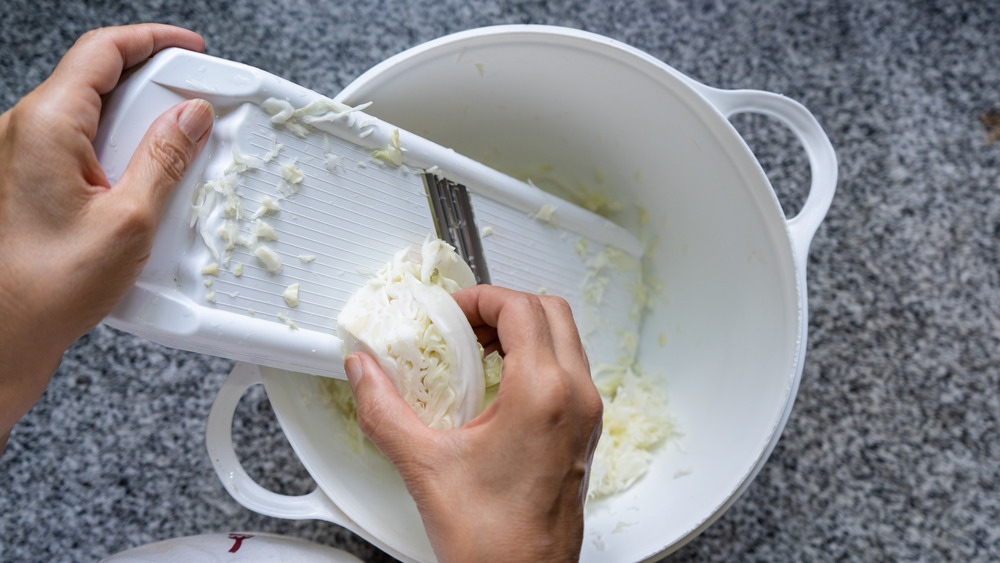 Slicing cabbage with mandoline