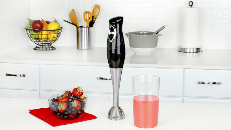 Handheld blender on a white countertop