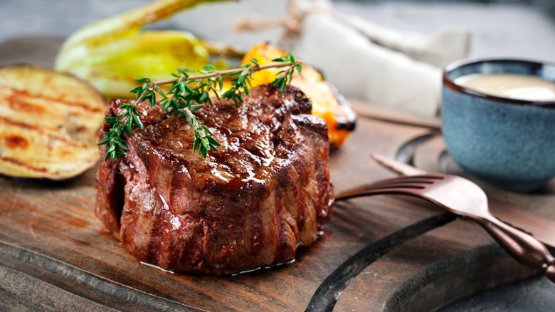 Tenderloin steak with rosemary garnish