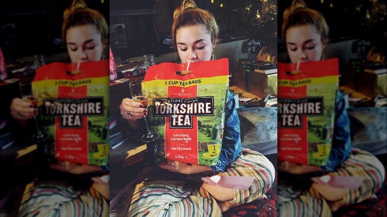 Florence Pugh holding a large bag of Yorkshire Tea