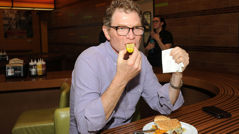 A shot of Bobby Flay eating