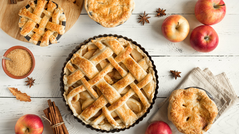 apple pie with lattice crust and whole apples