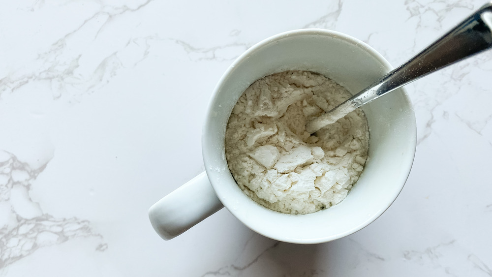 flour and cocoa in mug