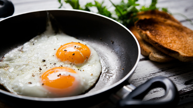 fried eggs in pan