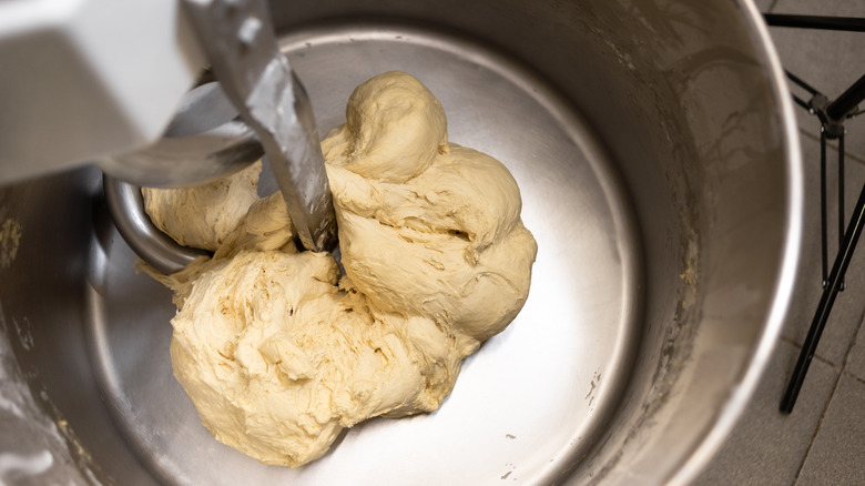 stand mixer stirring pizza dough