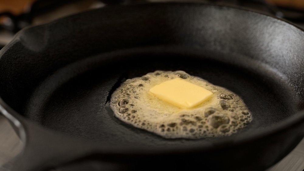 Cast iron skillet with melting butter