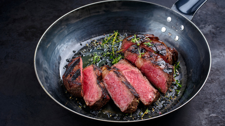 wagyu steak cooking in skillet