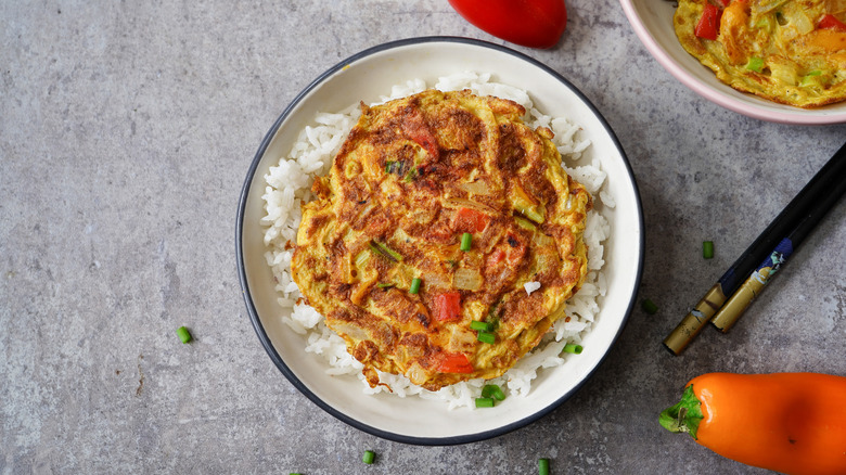 Egg foo yung with chopsticks