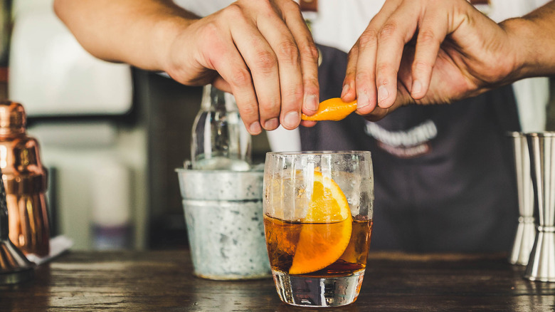 Bartender making Negroni