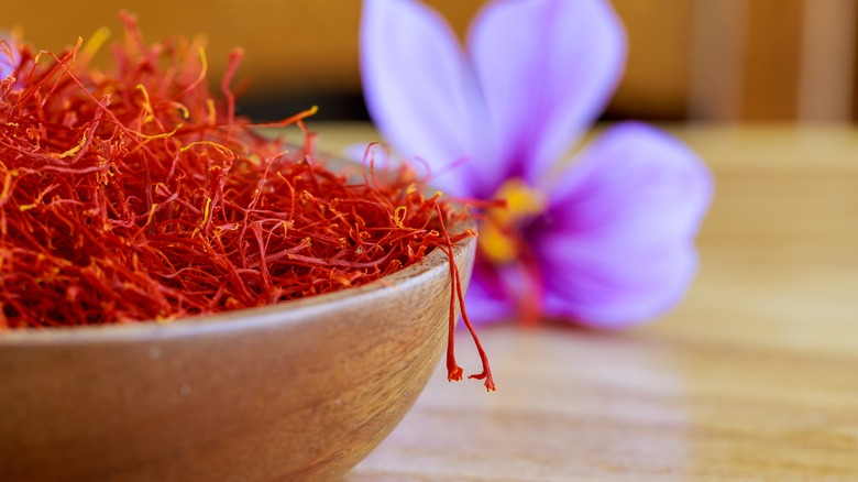 bowl of saffron in front of flower