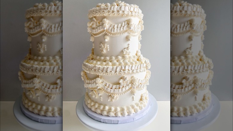 An ornate white Lambeth wedding cake