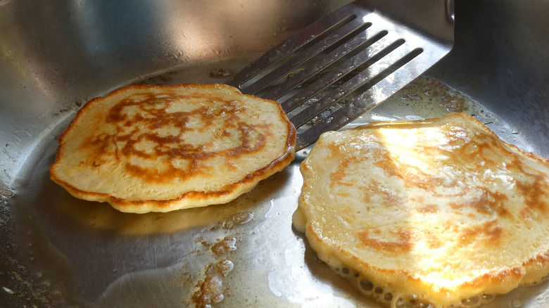 Flipping pancakes with a spatula