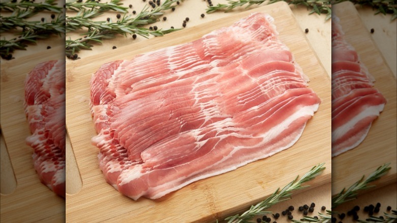 bacon laying on cutting board