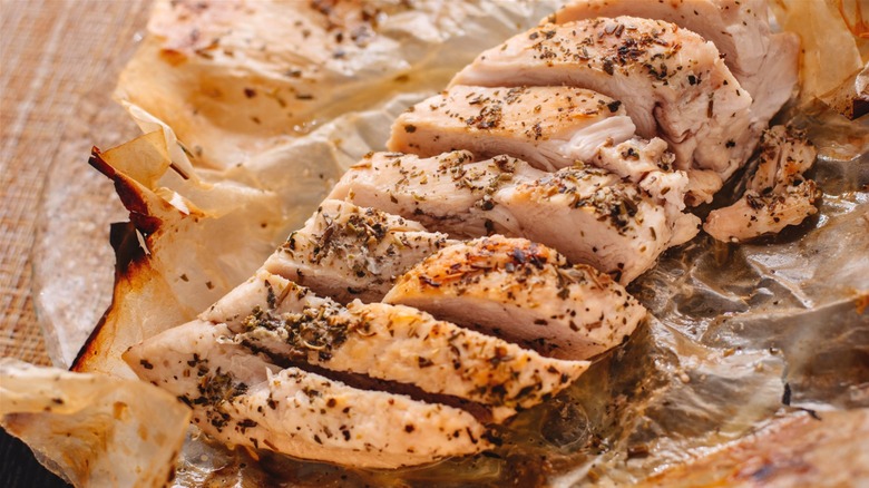 cooked chicken breast in parchment paper